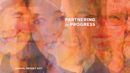 2017 annual report cover: the words partnering for progress superimposed over a collage of people's faces